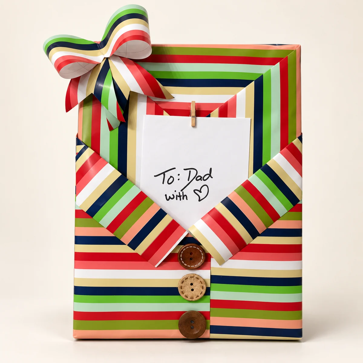 Gift wrapped to look like a striped collared shirt with wooden buttons and a bow tie