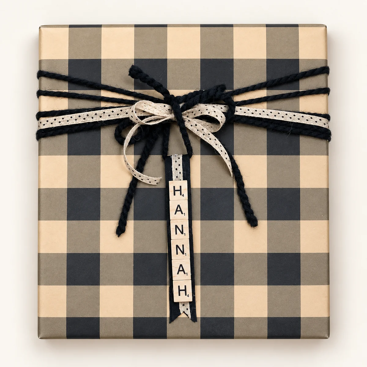 Buffalo check gift with black yarn, burlap ribbon and Scrabble-tile name tag
